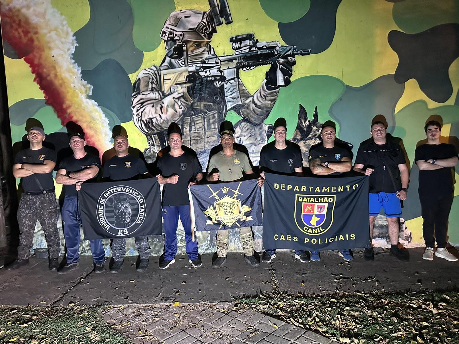 Jeremy standing with a group of working-dog handlers
